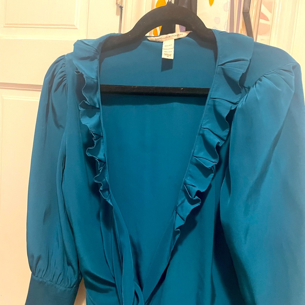 Teal Diane von Furstenberg 100% silk wrap blouse.